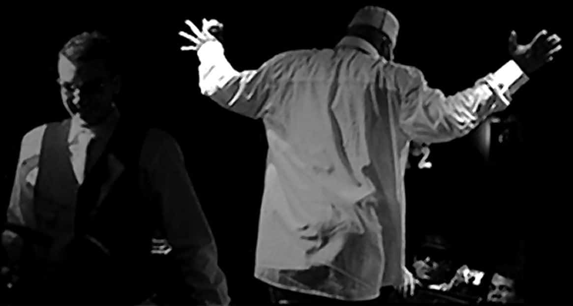 Darrick Angelone and Kool Keith on stage in Amsterdam, in black and white