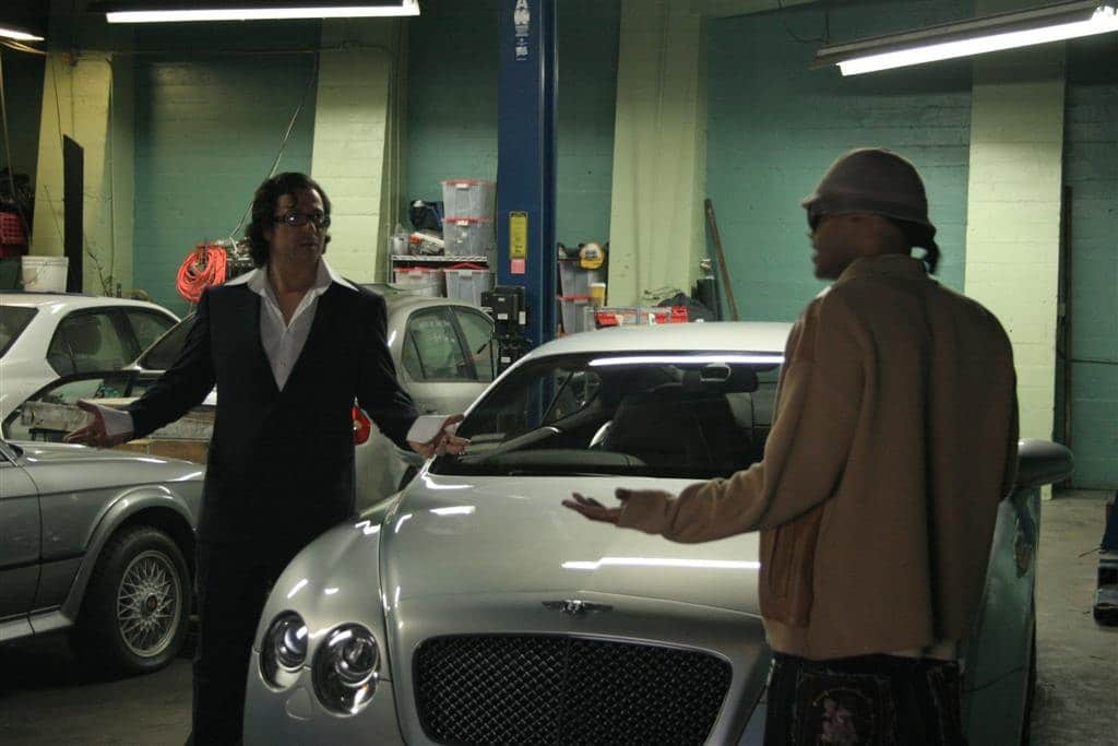 Peter Greene in a garage scene on the set of King of Hollywood, in black and white